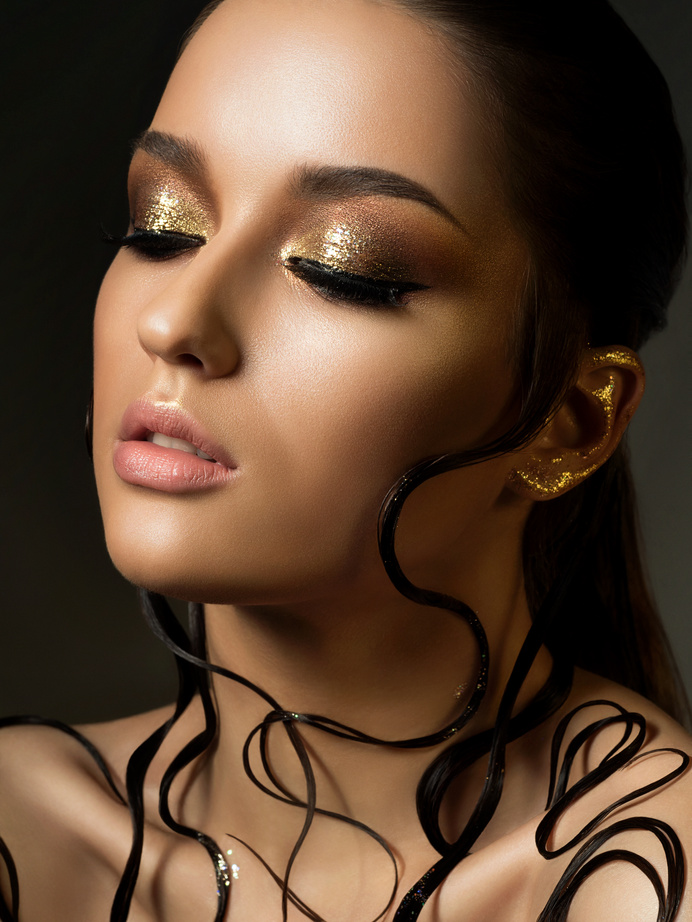 Woman with Fashion Golden Makeup